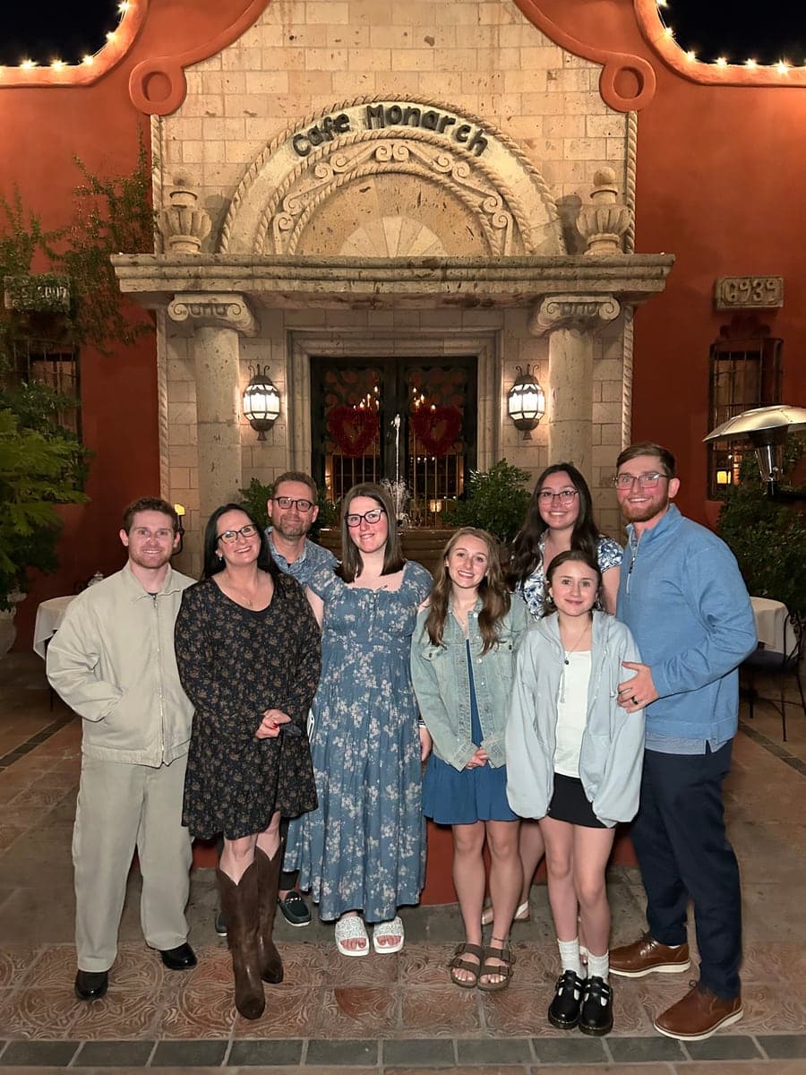A group outside a café at night.